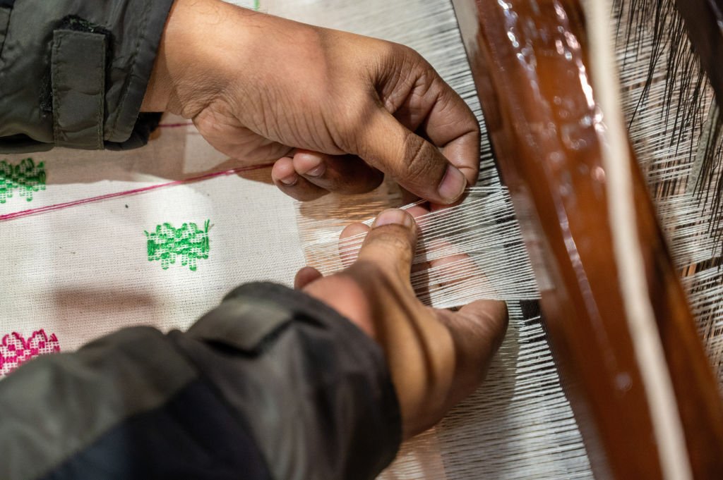 An Indian handloom weaver from Nadia District showcases