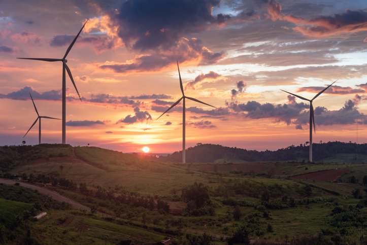 the wind turbine field in the sunset moment