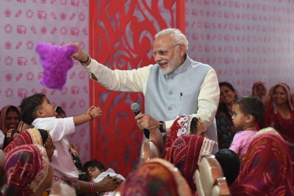 Jhunjhunu: Prime Minister Narendra Modi interacts with the Beti Bachao Beti Padhao beneficiaries in Jhunjhunu, Rajasthan on March 8, 2018. (Photo: IANS/PIB)