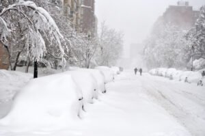 Block of snow-covered cars
