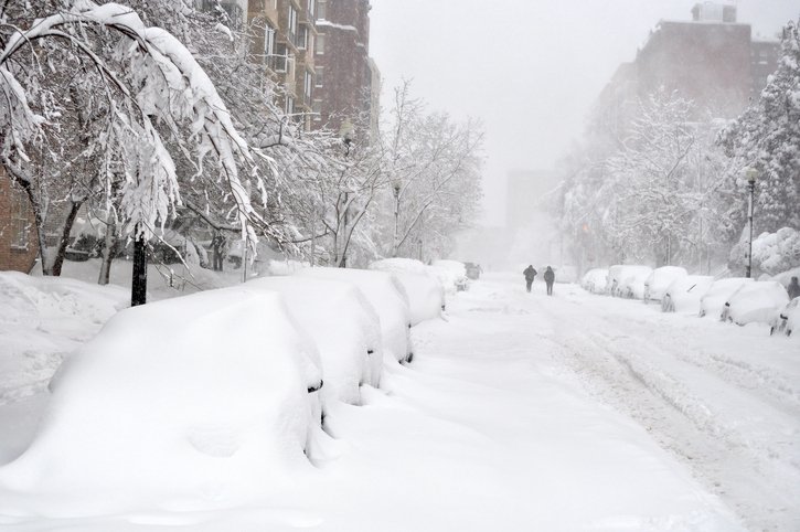 Block of snow-covered cars