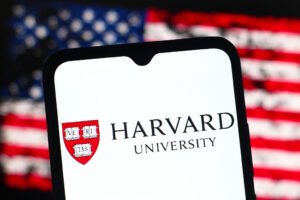 In this photo illustration, the Harvard University logo is