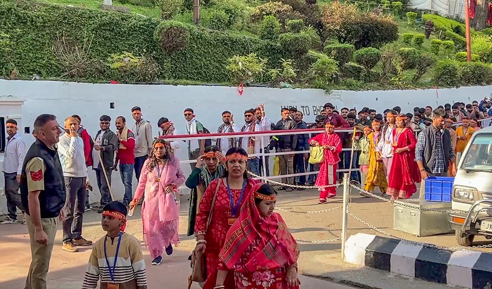 Devotees stand in queue to register themselves for the pilgrimage to the holy shrine of Mata Vaishno Devi temple