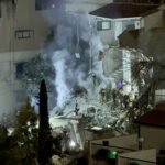 Four people were injured when an Iranian missile directly hit a building in Haifa
